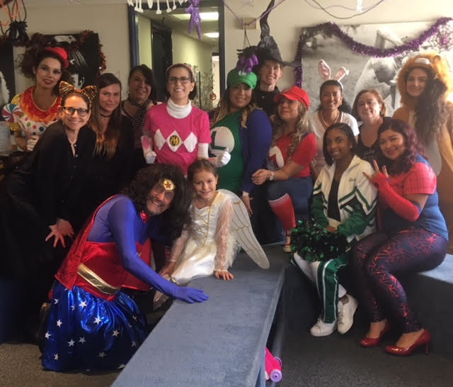Group photo of staff in Halloween costumes